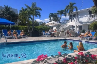 People enjoying the sunshine around the pool at Sea Spray Inn, Lauderdale-by-the-Sea People enjoying the sunshine around the pool at Sea Spray Inn, Lauderdale-by-the-Sea